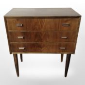 A Danish three-drawer chest on tapered legs, width 56cm.