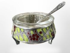 A Russian white metal salt and spoon, with cloisonné enamel decoration.
