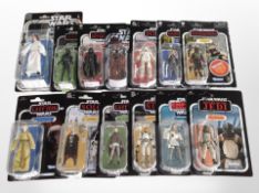13 Kenner Star Wars figurines including The Mandalorian, The Force Awakens, etc., boxed.