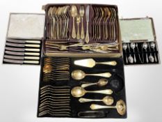 Two trays of gold-plated cutlery and a further boxed set of teaspoons and knives.