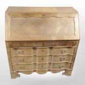 A Danish blonde oak fall-front bureau, 100cm wide x 52cm deep x 105cm high.