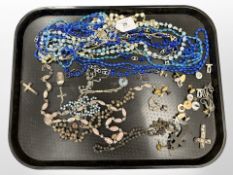 A group of costume jewellery, beaded necklaces, enamelled pendant on chain, rosaries,
