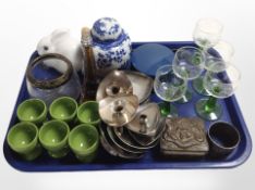 A group of silver-plated candle stands, etched drinking glasses, blue and white ginger jar, pens,