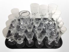 23 assorted crystal drinking glasses and a further swing-handled jar.