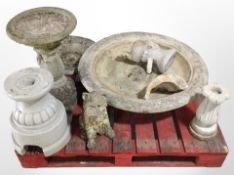 A group of concrete garden ornaments, pedestal birdbath, etc.