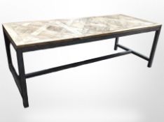 A contemporary metal-framed pine-topped rectangular dining table,