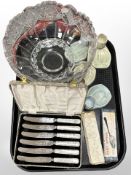 A heavy cut-crystal fruit bowl, together with a set of six mother of pearl effect butter knives,