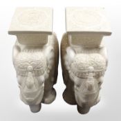A pair of glazed ceramic elephant plant stands, height 44cm.