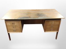 A 20th-century Danish oak twin pedestal writing desk fitted six drawers and three shelves to the