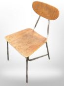 A 20th-century metal-framed laminated teak chair.