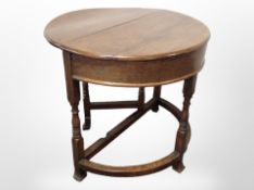 A Victorian oak demi-lune drop-leaf dining table with hinged top, width 89cm.