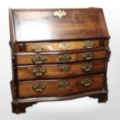 An early 19th century continental rosewood and pine serpentine bureau bookcase base,