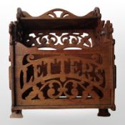 A fretwork letterbox, height 24cm.