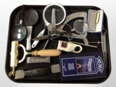 A group of magnifying glasses, harmonicas, boxed corkscrew, scale, etc.