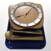 A Junghans teak wall clock with brass weights and pendulum.