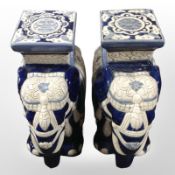 A pair of glazed ceramic elephant plant stands, height 42cm.