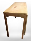 A Danish blonde oak extending drop-leaf table, width 120cm.