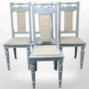 A set of four painted pine dining chairs.