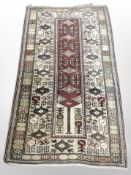 A Caucasian rug, 178cm x 102cm.