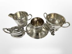 A silver sugar and cream jug, Birmingham 1932 marks, together with a silver mustard pot with spoon,