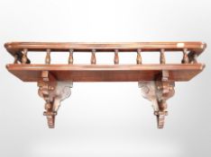 A reproduction mahogany galleried wall shelf, width 79cm.