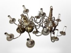 Two brass six-sconce pendant light fittings, wired for electricity, diameter 57cm.