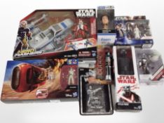 Eight Hasbro and Disney Store Star Wars figurines, boxed.