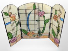 An Arts and Crafts-style leaded glass fire screen, height 82cm.