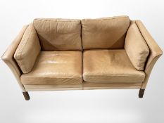 A 20th-century Danish tan leather two-seater settee, width 154cm.