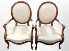A pair of 19th-century continental carved mahogany armchairs.