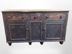 A pine sideboard in a scumbled painted finish, 152cm wide x 48cm deep x 89cm high.