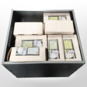 A square galvanised planter containing a quantity of Taison lights.