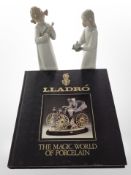 Two Lladró figures of girls in night dress, together with a Lladró volume,