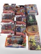 11 Hasbro and Bandai figurines including Iron Man, Power Rangers, Indiana Jones, etc., boxed.
