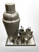 A mid-20th century Chinese pewter cocktail set comprising of shaker, six measures, and tray.