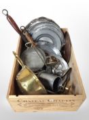 A wine crate containing silver plate and pewter dishes, 19th-century brass colander, pans, etc.
