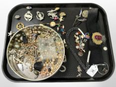 A tray of naval arm band, costume jewellery, military badges, Scottish brooch (af).