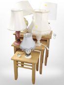 A contemporary pine nest of three tables, and five modern table lamps.
