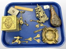 An antique copper powder flask, together with brass door knocker modelled as a ship, keys,