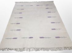 An Eastern flat-weave Kilim on cream ground, 250cm x 176cm.
