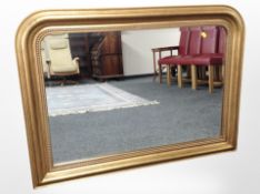 A Victorian-style gilt-framed overmantle mirror, 110cm x 80cm.