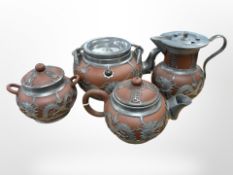 A Chinese red ware four-piece tea service with pewter overlay.