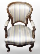 A 19th-century continental carved mahogany armchair, width 59cm.