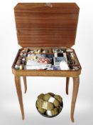 An inlaid sewing box and contents, and several skeins of wool.