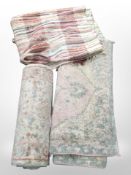 Three contemporary woolen rugs.