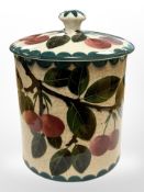 A Wemyss ware lidded pot, height 15cm.