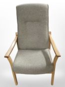 A Danish beech armchair upholstered in oatmeal fabric.