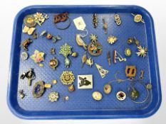 A group of antique and later costume brooches, pocket watch key, animal brooches, etc.