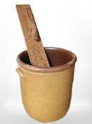 A Scandinavian carved teak mangle board, together with a stoneware crock pot, height 34cm.