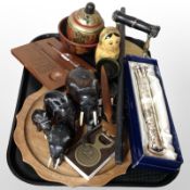 A group of African carved elephants, thermometer, brass iron, Russian Babushka doll, etc.